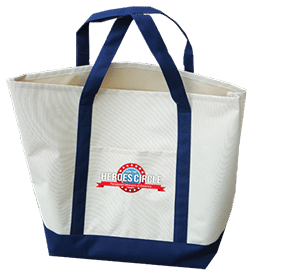 A white and navy blue tote bag with dark blue handles and a front pocket, featuring a "Heroes Circle" logo with stars and a red ribbon.